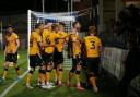 AWAY DAY JOY: Newport's players celebrate after Dom Telford scored their winning goal