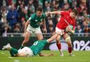 EDGE: Dragons and Wales flanker Taine Basham, right, is tackled by Ireland’s Garry Ringrose in Dublin