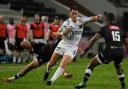 HARD GOING: Winger Jared Rosser takes on Anthony Volmink of Cell C Sharks