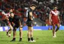 OVERPOWERED: Wales' Connor Davies (centre) looks dejected