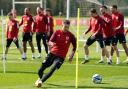 Wales' Aaron Ramsey (centre) during a training session at Vale Resort, Hensol. Picture date: Monday March 27, 2023.