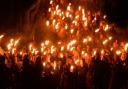 Participants in the torchlit march as part of a previous edition of the Newport Rising Festival.