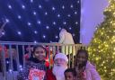 Children at NYCA with Santa and gifts