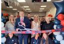 Staff members (store manager Kay Gregory far left) at One Stop Pontnewydd with Labour parliamentary candidate for Torfaen Nick Thomas-Symonds as the official launch ribbon is cut