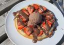 A freshly made waffle topped with strawberries and chocolate sauce is served at the Fferm Gelli café, proving hard to resist after a walk around the farm.