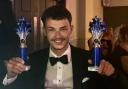 Manager Cameron Jones with the pub's two awards of the night