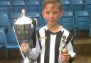 TROPHY: Ellis Rhys Paterson, captain of Risca United Academy under-12s