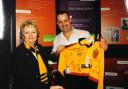 Janet Harris presenting a sponsor with a signed shirt in 2000.