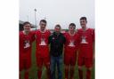 WALES HONOUR: From the left, Tredegar Town players Jake Forsyth, Macaulay Tuffin, Simon Jones (under 18s coach), Jack Cullinane and Elliott Jones