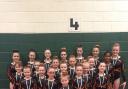 The competitive acrobatic squad from Wye Gymnastics with their latest haul of medals
