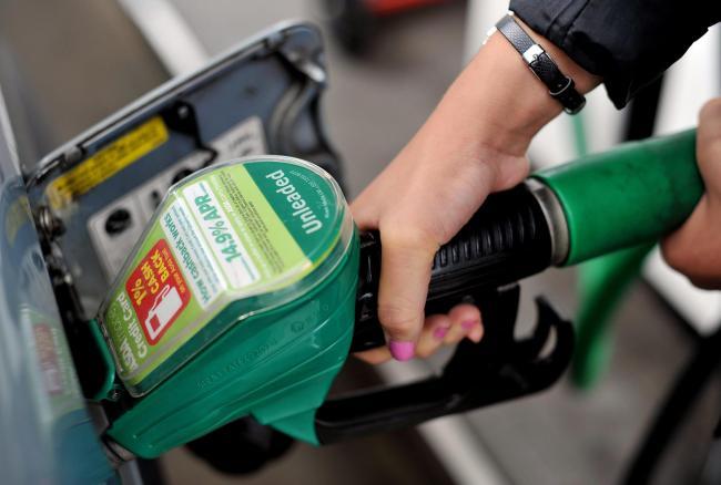 A person using an Asda petrol pump. Picture: Nick Ansell/PA Wire.