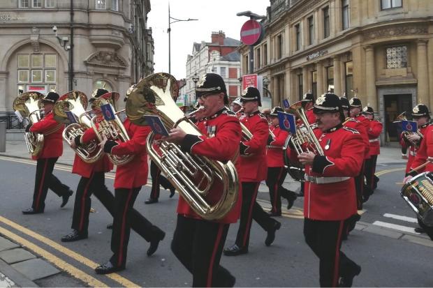 South Wales Argus: The Royal Welsh regimental band and corps of drums leads the parade through Newport, as the Royal British Legion is granted the freedom of the city.