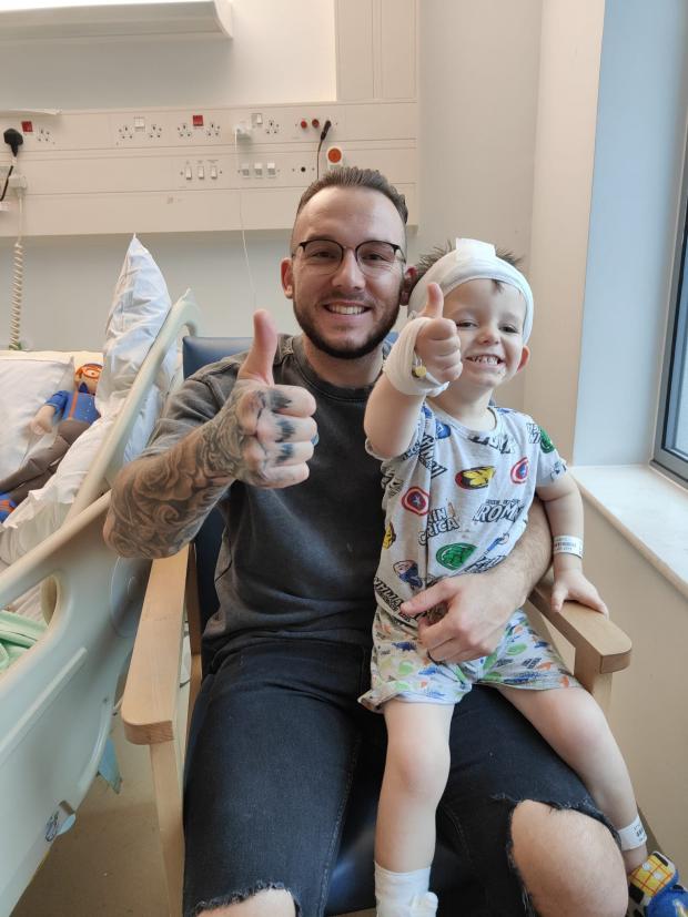 South Wales Argus: Charlie with dad Chris in hospital