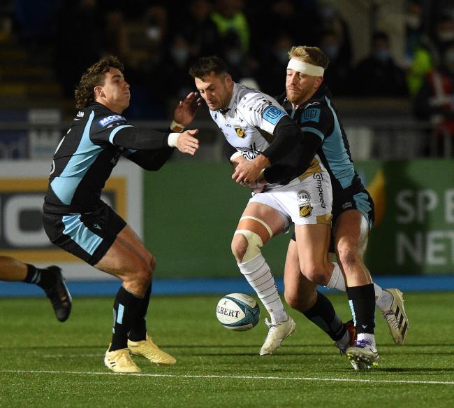 DISAPPOINTMENT: Josh Lewis is tackled in the Dragons' defeat to Glasgow at Scotstoun Stadium