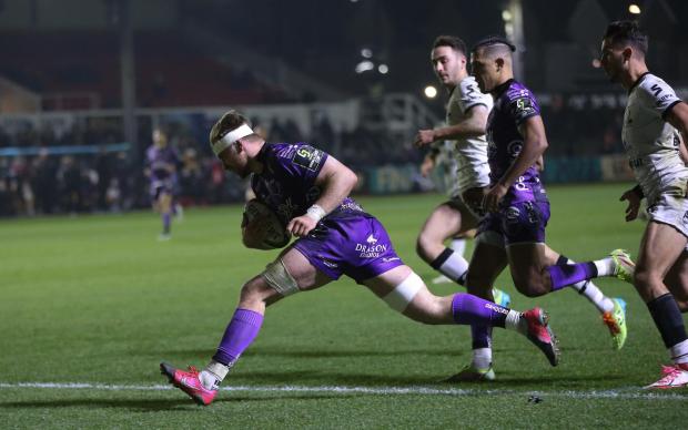 South Wales Argus: TRY: Aaron Wainwright goes over for the Dragons