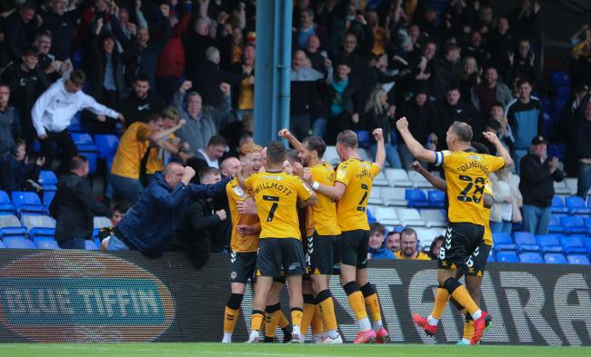 BACKING: County celebrate their win at Oldham on opening day