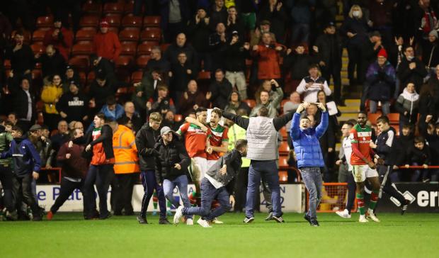 South Wales Argus: BEDLAM: Walsall fans celebrate their leveller