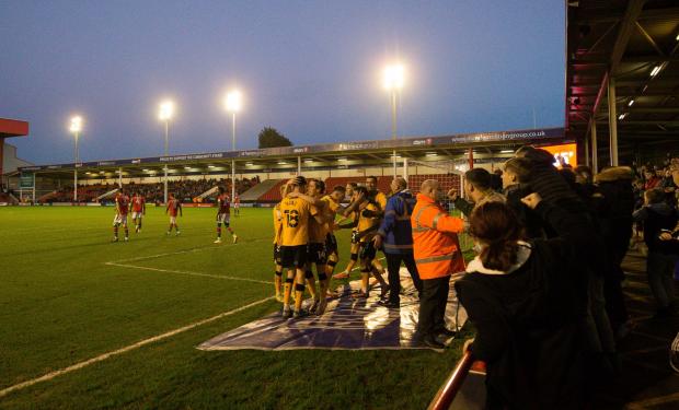 South Wales Argus: JOY: County celebrate with their fans after making it 3-2 at Walsall