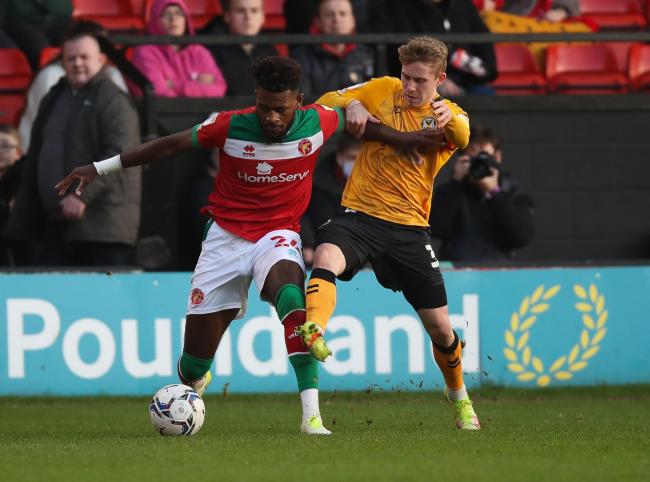 TUSSLE: Oliver Cooper of Newport County and Rollin Menayese of Walsall compete for the ball