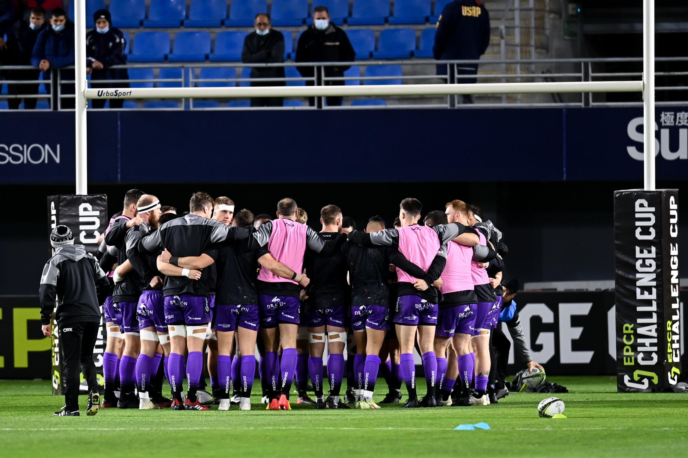 The Dragons huddle before facing Perpignan in the Challenge Cup