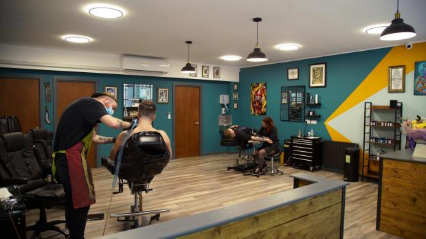 South Wales Argus: Jack Jones and Kelly Brown working at the spacious tattoo studio (Picture: Jake Abraham)