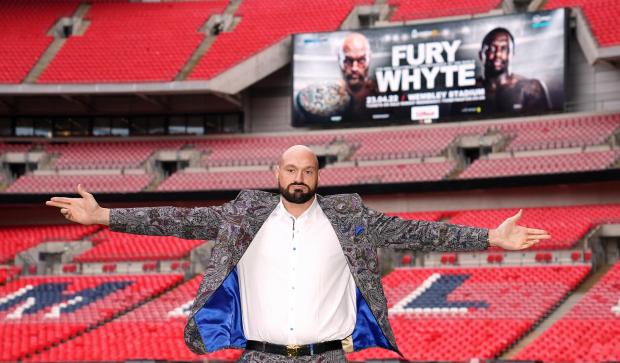 South Wales Argus: Tyson Fury poses on the pitch after the press conference at Wembley Stadium, London (PA)