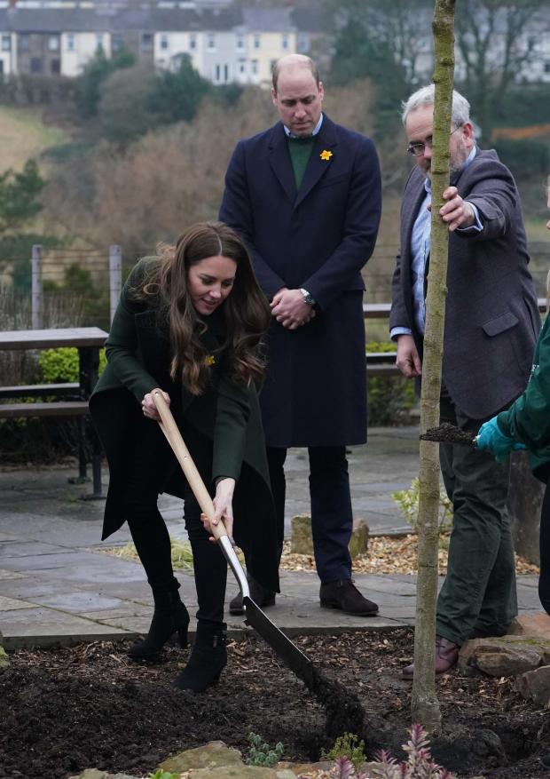 South Wales Argus: The Duchess of Cambridge planting a tree in Blaenavon as part of the Queen's Green Canopy. Picture: Steve Parsons/PA Wire.