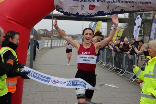 South Wales Argus: That sweet winning feeling for Elizabeth Dimond who crossed the line in one hour and 21 minutes. Picture: Ollie Barnes.