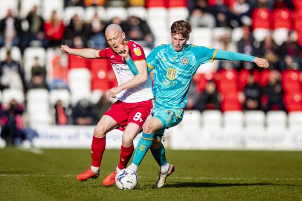 South Wales Argus: Rob Street battles Stevenage's Jake Taylor for possession. Picture: Huw Evans Picture Agency.