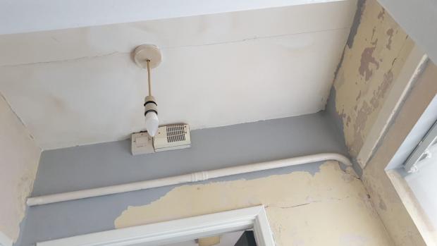 South Wales Argus: Ms Stickland says the inspector told her to scrape off the paint, which revealed cracks in the walls. (Picture: Kelly Stickland)
