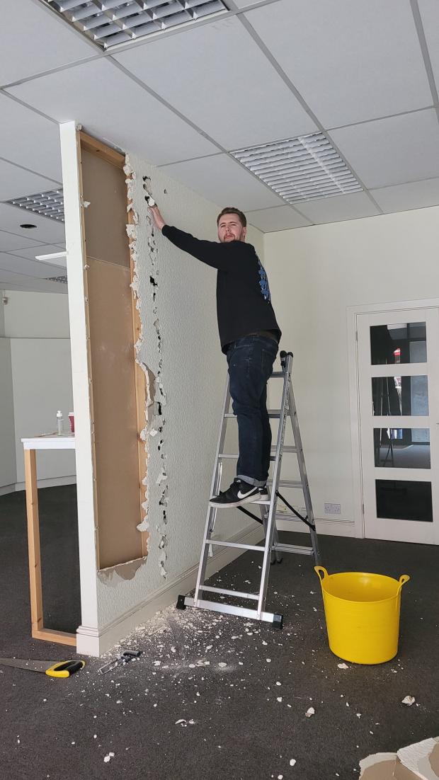 South Wales Argus: Joe Wagstaff helping with building refurbishments