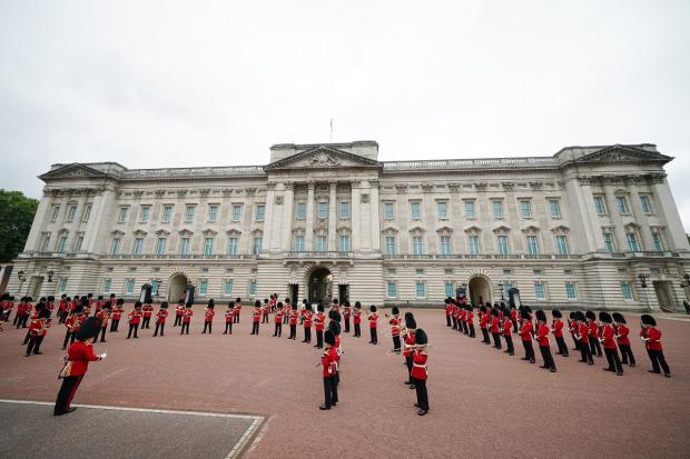 South Wales Argus: Members of the Nijmegen Company Grenadier Guards and the 1st Battalion the Coldstream Guards take part in the Changing of the Guard, in the forecourt of Buckingham Palace. Picture: PA
