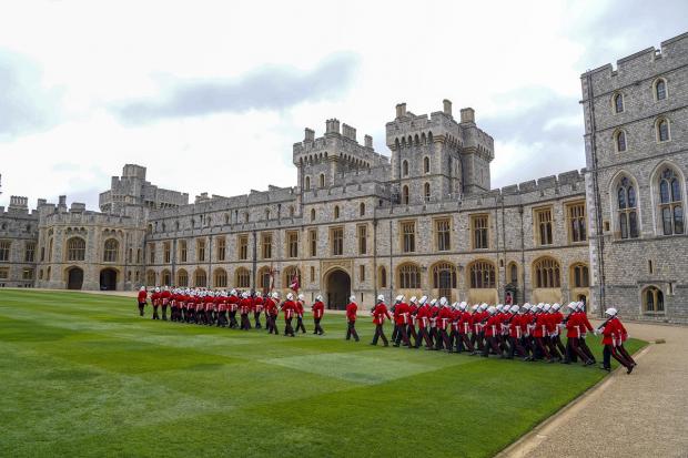 South Wales Argus: The Earl of Wessex presents new colours to the Royal Gibraltar Regiment during a ceremony at Windsor Castle. Picture: PA