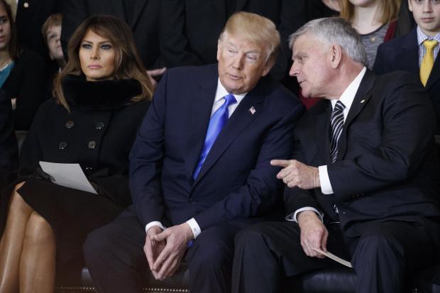 South Wales Argus: Then president Donald Trump with Franklin Graham, right, at a service in January 2018 following his father Billy's death. The Evangelical preacher is set to hold an event at the ICC Wales in Newport.