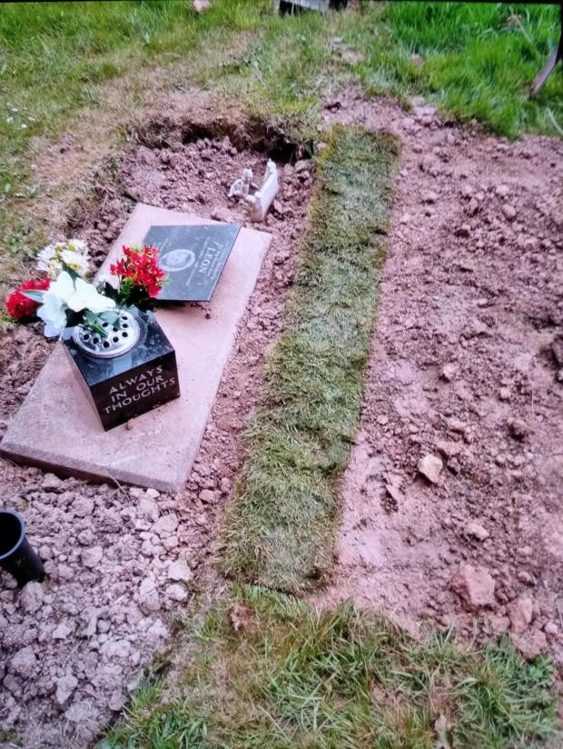 South Wales Argus: The debris has now been cleared, but it appears to have discoloured the stone on Leon's grave. Picture: Cheryl Downes.