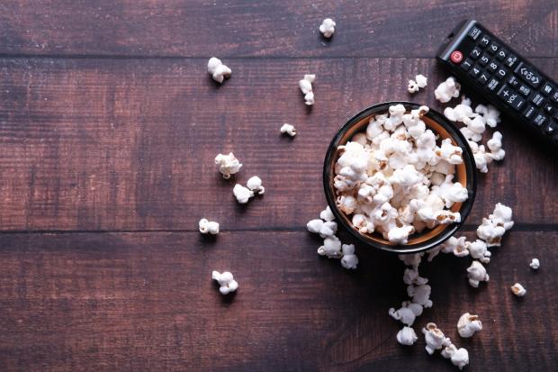 South Wales Argus: A bowl of popcorn and a TV remote (Canva)