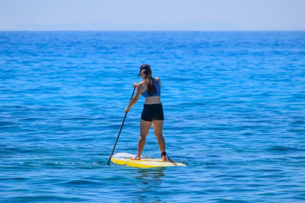 South Wales Argus: A person paddleboarding (Canva)