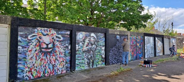 South Wales Argus: Local artists Anthony Smith, Rob Carlton, Alex Arnell and James Annandale have transformed these garages into something wonderful. 