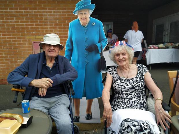 South Wales Argus: Residents of Capel Grange Nursing Home in Newport pose with 'Her Majesty'. Picture: Capel Grange Nursing Home