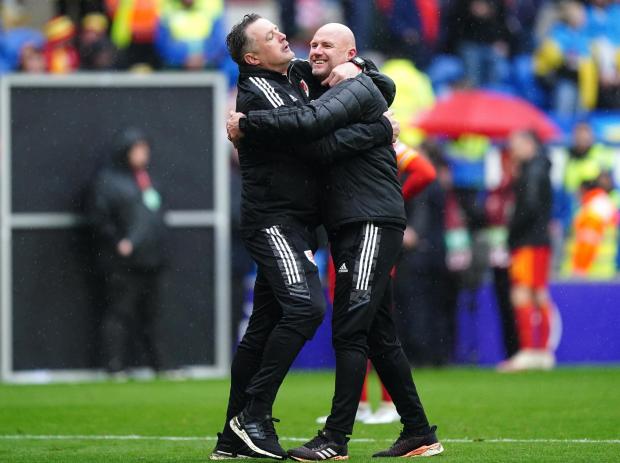 South Wales Argus: Caretaker manager Rob Page (right) embraces goalkeeping coach Tony Roberts at full-time. Picture: PA Wire