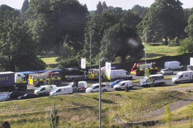 South Wales Argus: CCTV still of the emergency services dealing with the overturned lorry at Tredegar Park roundabout in Newport. Picture: Traffic Wales