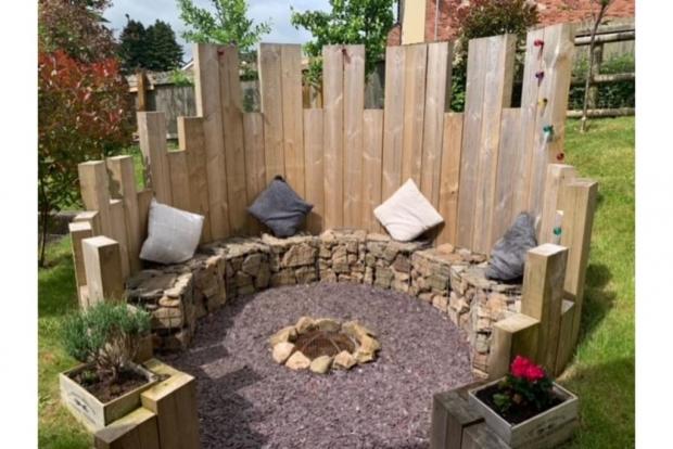 South Wales Argus: Outdoor seating in the garden around a fire pit (Credit: Purplebricks)