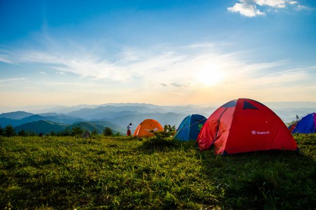 South Wales Argus: Tents in the countryside. Credit: Canva