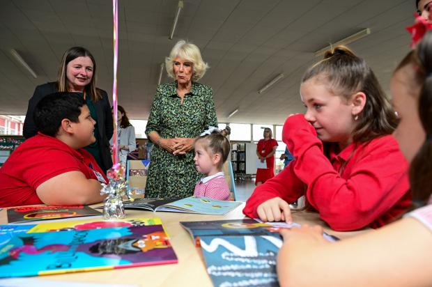 South Wales Argus: The Duchess of Cornwall meets pupils in the new library at Millbrook Primary School in Bettws, Newport.  Credit: Finbarr Webster/PA Wire
