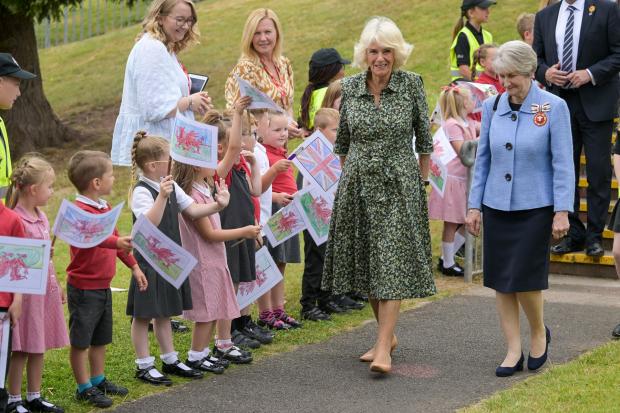 South Wales Argus: The Duchess of Cornwall is welcomed to Millbrook Primary School in Bettws, Newport.  Credit: Finbarr Webster/PA Wire