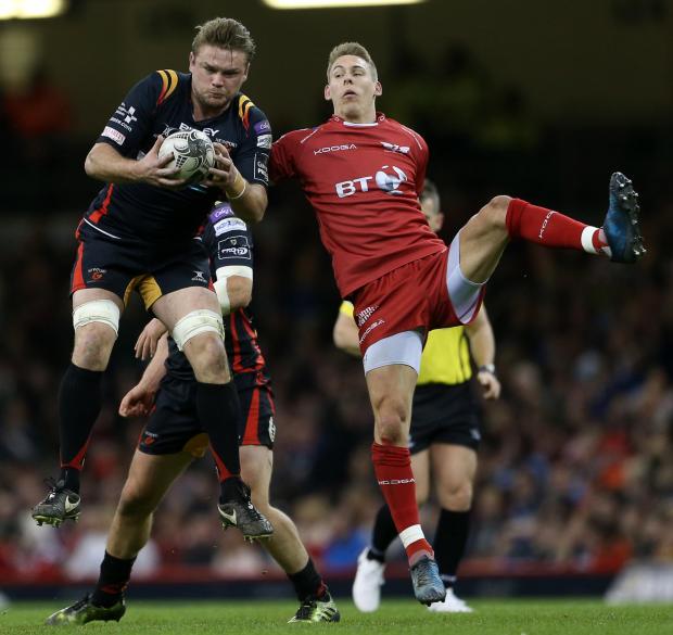 South Wales Argus: Lewis Evans claims the ball above Wales and Lions star Liam Williams for the Dragons against the Scarlets