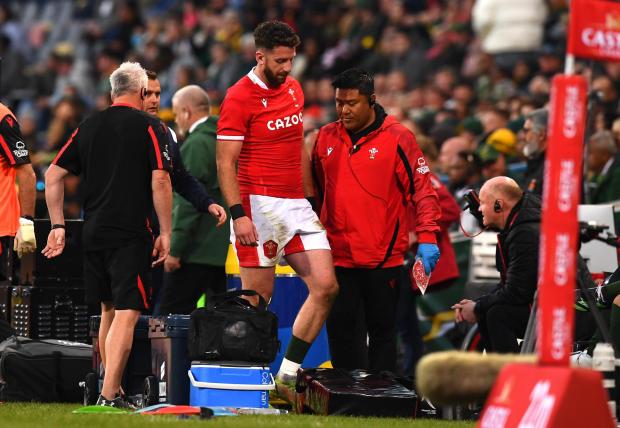 South Wales Argus: Alex Cuthbert is helped off after injury cut short his return to the side. Picture: Huw Evans Picture Agency.
