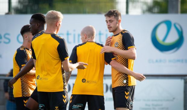 South Wales Argus: County players celebrate with goalscorer Lewis Collins in the win at Weston-Super-Mare. Picture: Newport County AFC.