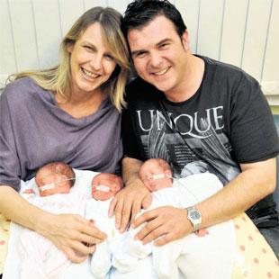 TRIPLE JOY: Charlotte Cousins and partner Gareth Vincent with their triplets, from left, Poppy, Sofia and Tilly