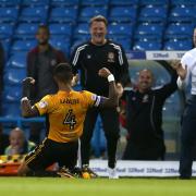 JOY: Captain Joss Labadie celebrates with Newport County boss Michael Flynn, right, and assistant Wayne Hatswell at Leeds United in August 2017
